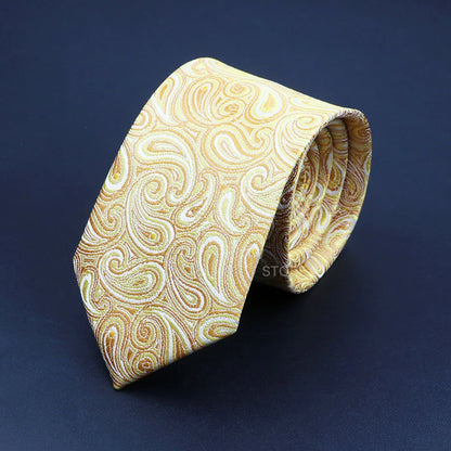 Gold patterned tie on a dark blue background