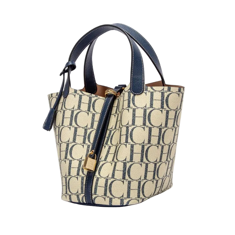 Beige handbag with blue handles and monogram pattern