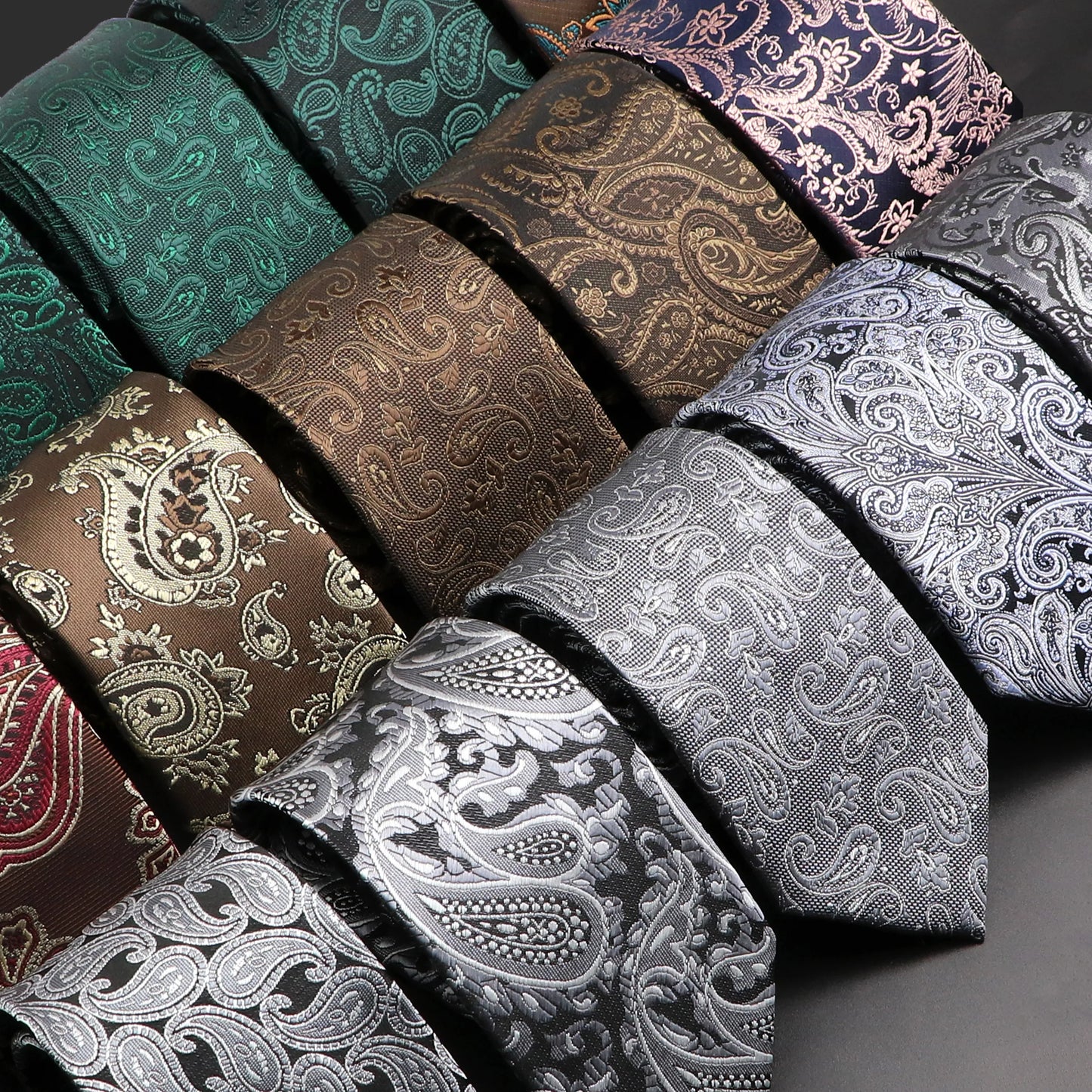 Collection of patterned ties in various colors on a gray background