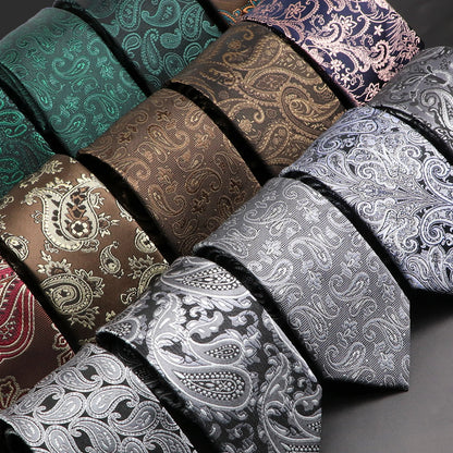 Collection of patterned ties in various colors on a gray background