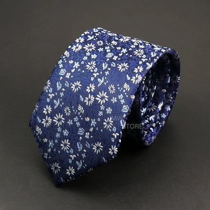 Blue floral patterned tie on a dark gray background