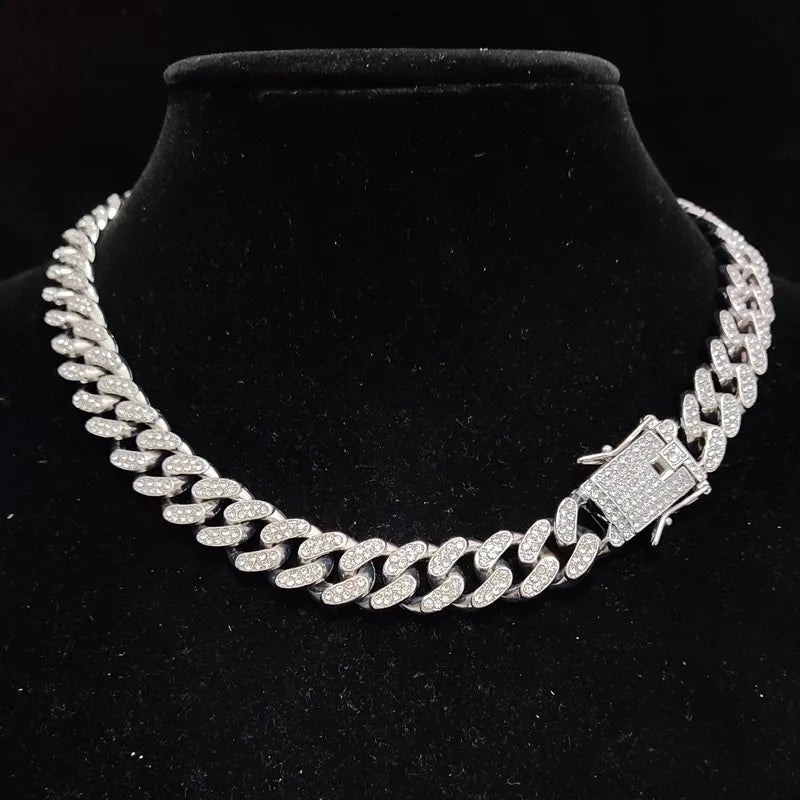 Silver chain necklace on a black velvet stand