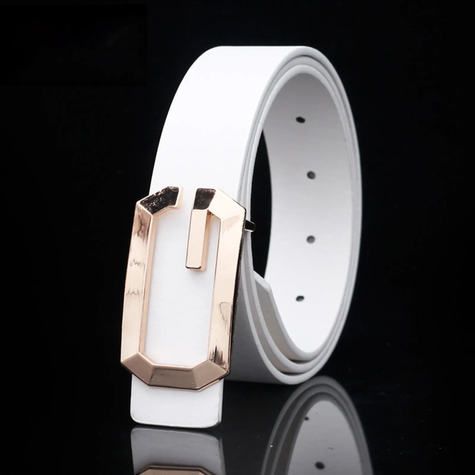 White belt with a rose gold buckle on a black background