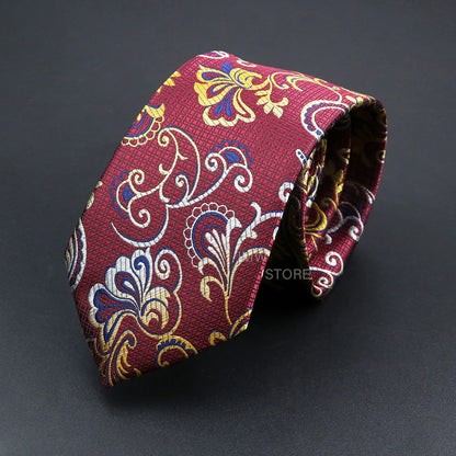 Red paisley patterned tie on a dark background