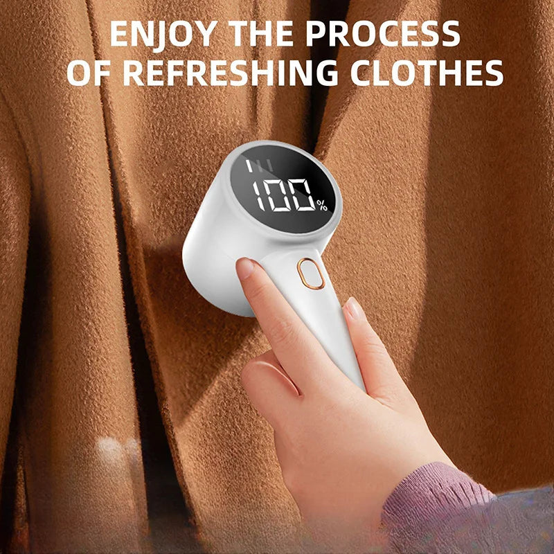 Hand holding a digital device against a brown fabric background with text 'Enjoy the process of refreshing clothes'.